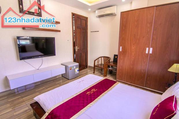 Bán khách sạn khu Á Châu 1T4L dt 90m có bìa hồng giá 12ty